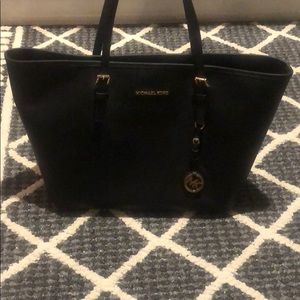 Authentic Michael Kors purse. Black/Gold detail.